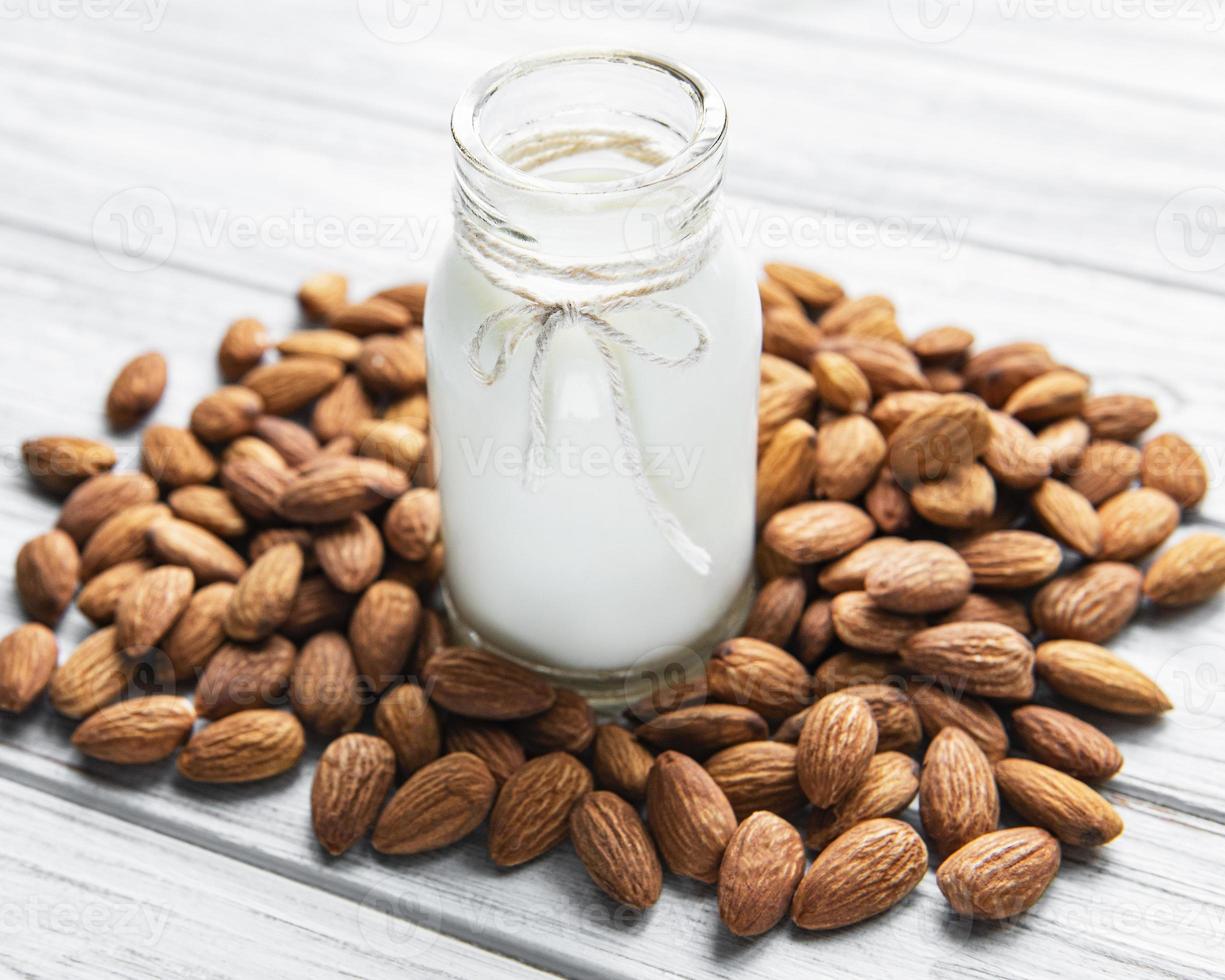 Almond milk with almonds photo