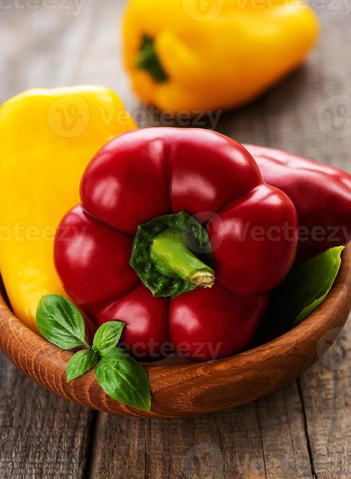 Bell peppers on a wooden background photo