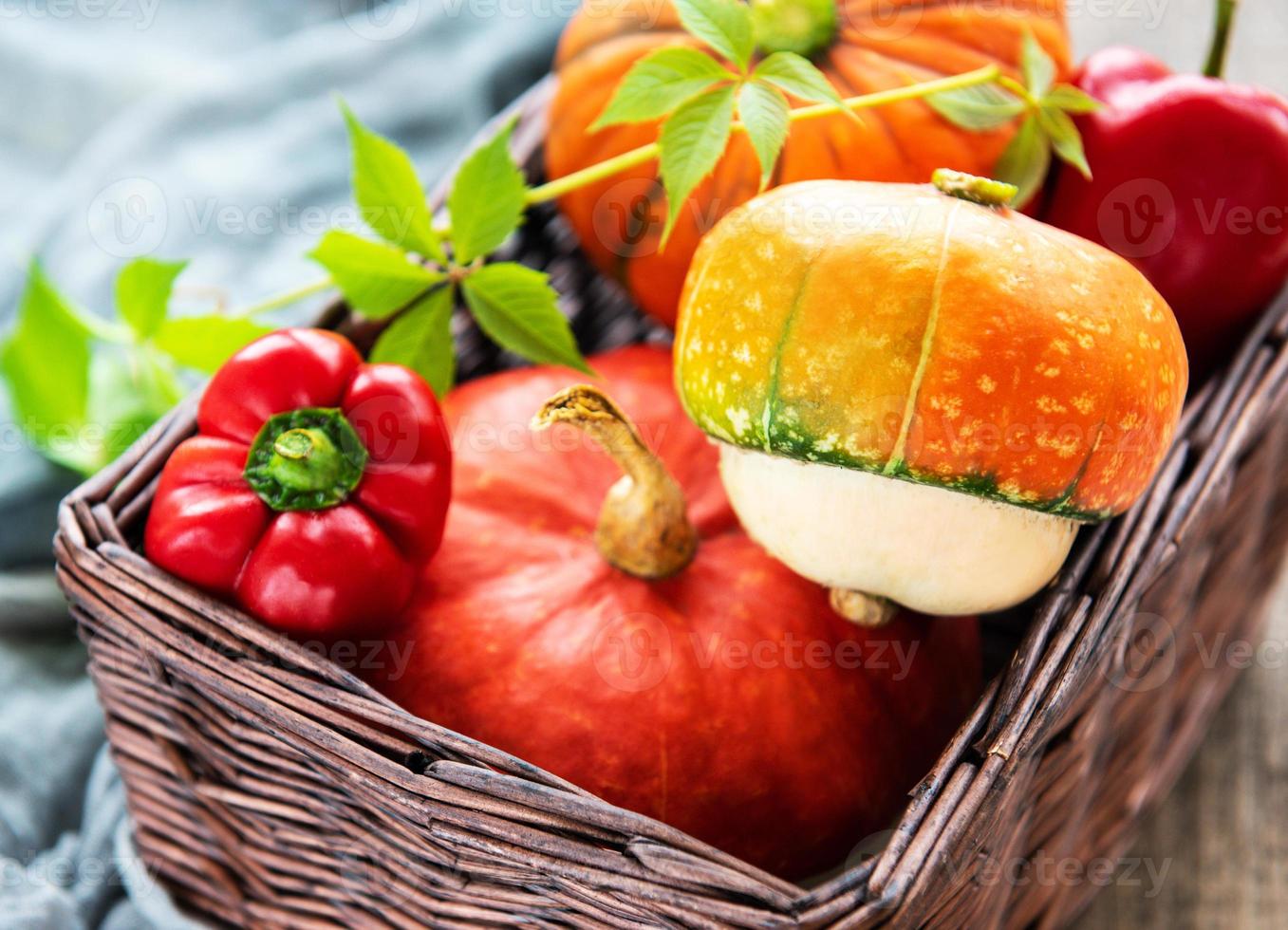 Pumpkins on a wooden background photo