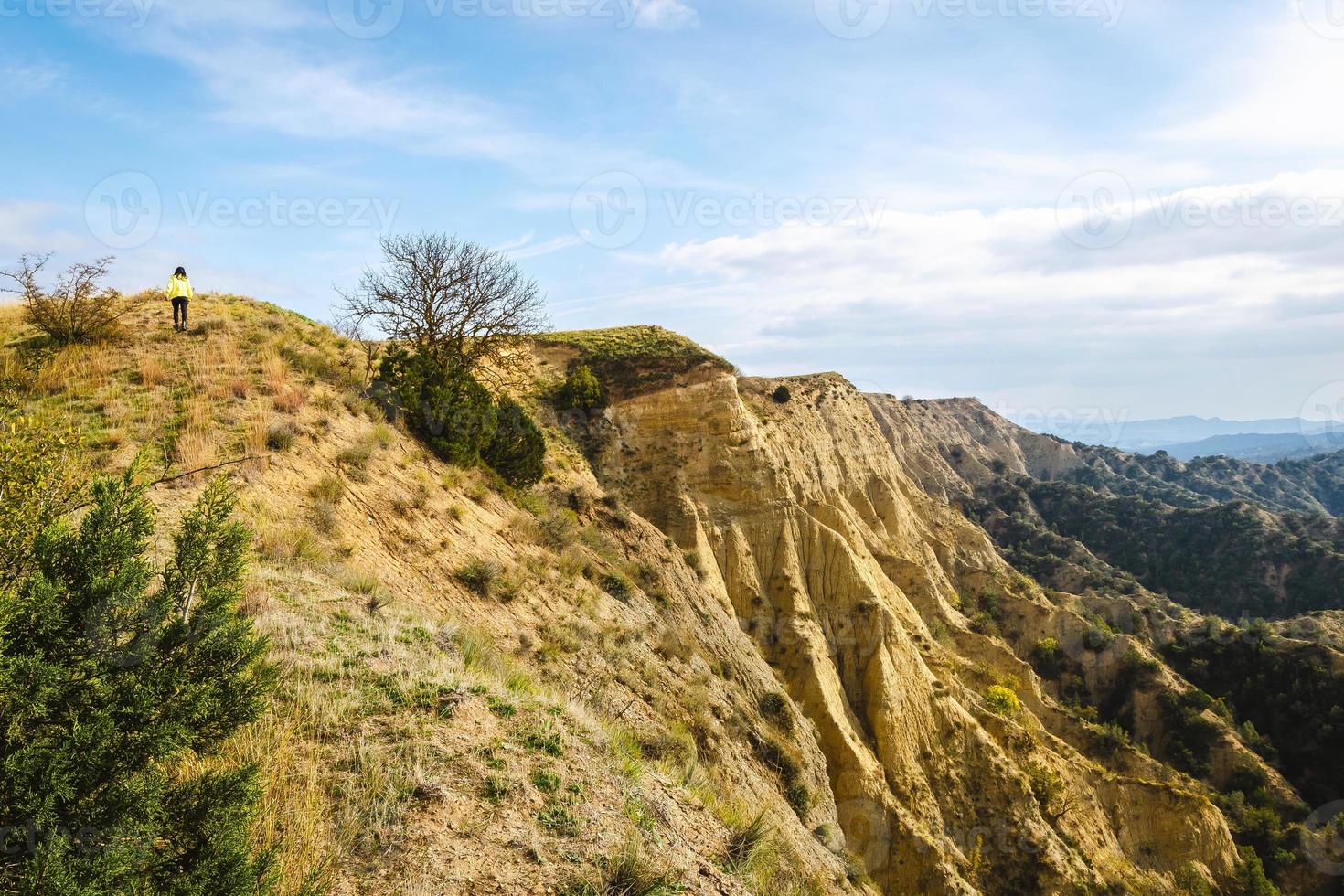 Female person walks around VAshlovani national park protected areas with beautiful landscape view of cliffs photo