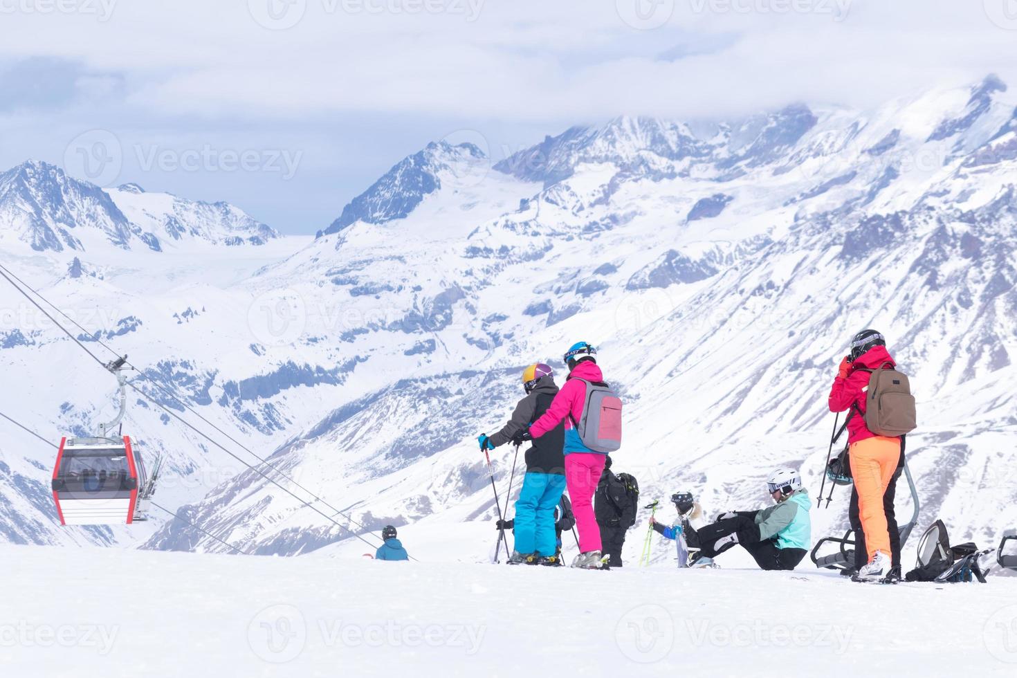 Skiers in caucasus mountains photo
