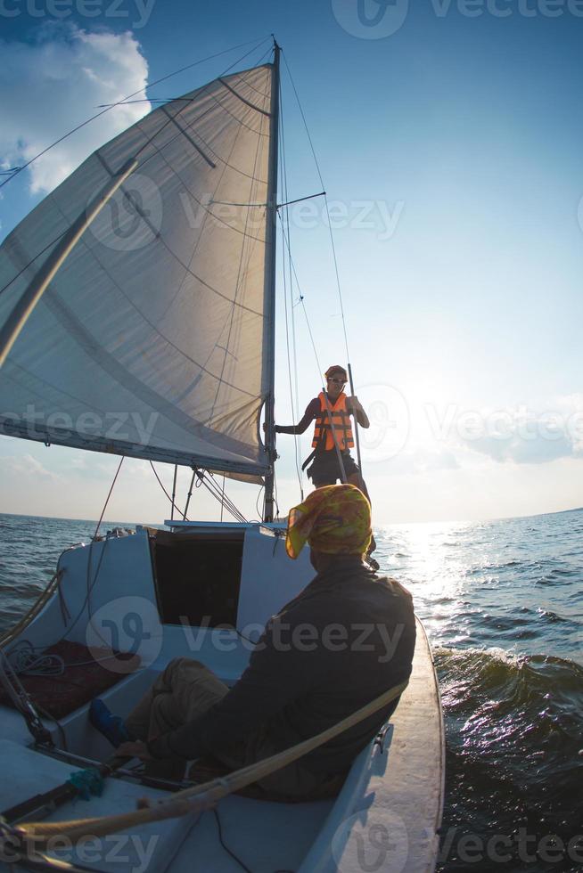 A man and a woman are traveling on a sailing yacht. photo
