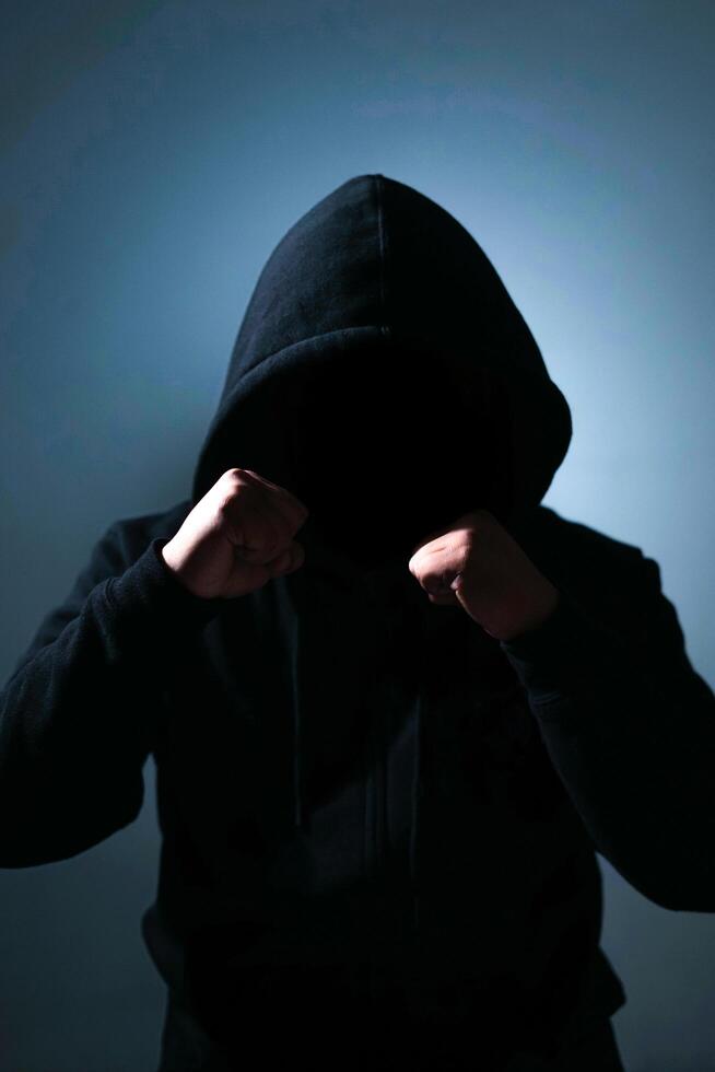 Indonesia, 21122021 - a silhouette of a man in a black hoodie 4909878 Stock  Photo at Vecteezy