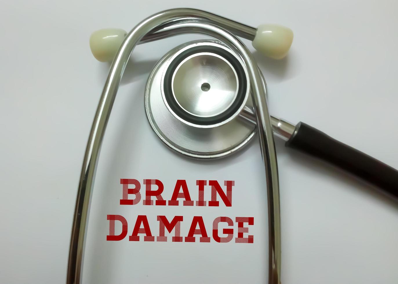 Brain damage word, medical term word with medical concepts in whiteboard and stethoscope. photo