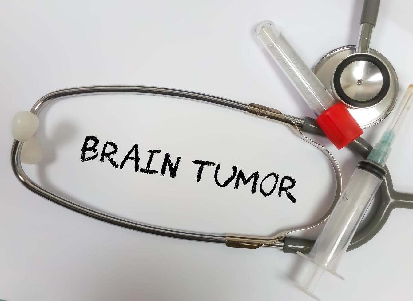 Brain Tumor term isolated with medical equipements on white background. photo