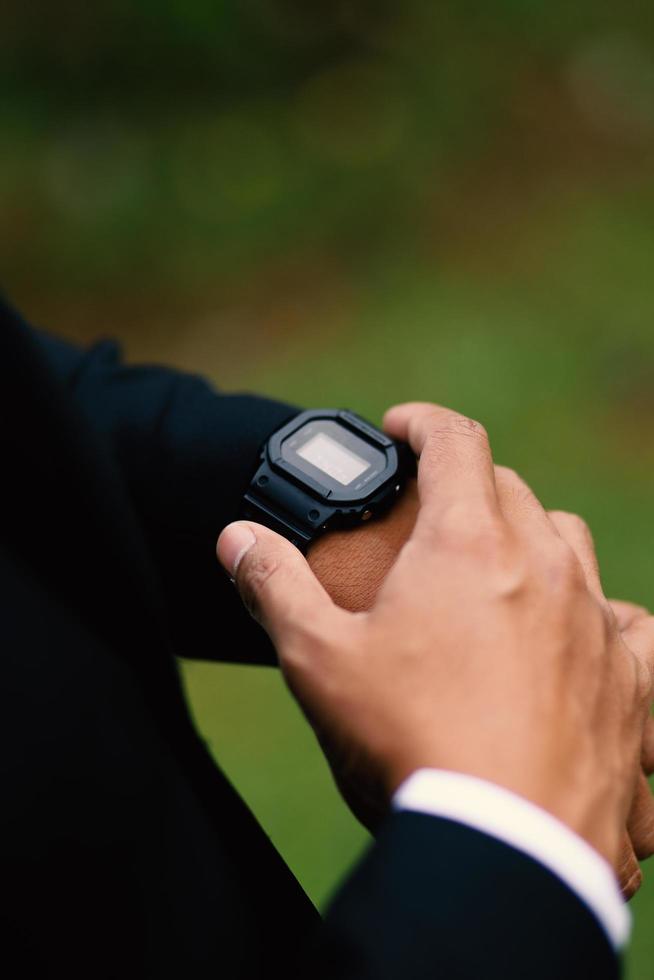 Man's watch on hand. Wedding ceremony photo