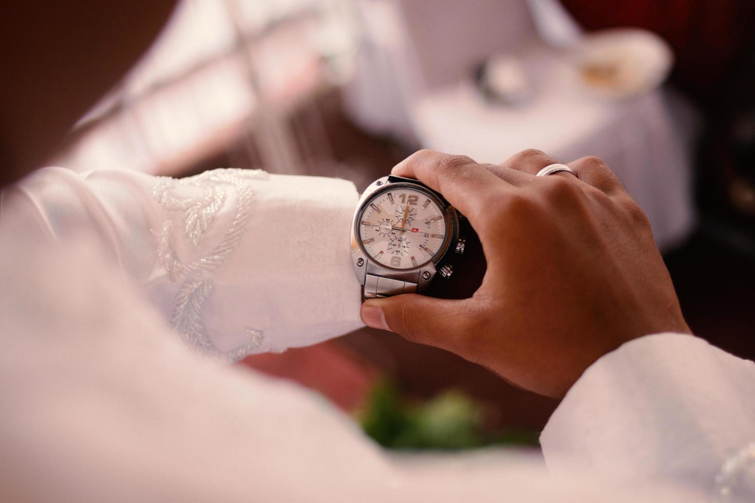 Man's watch on hand. Wedding ceremony photo
