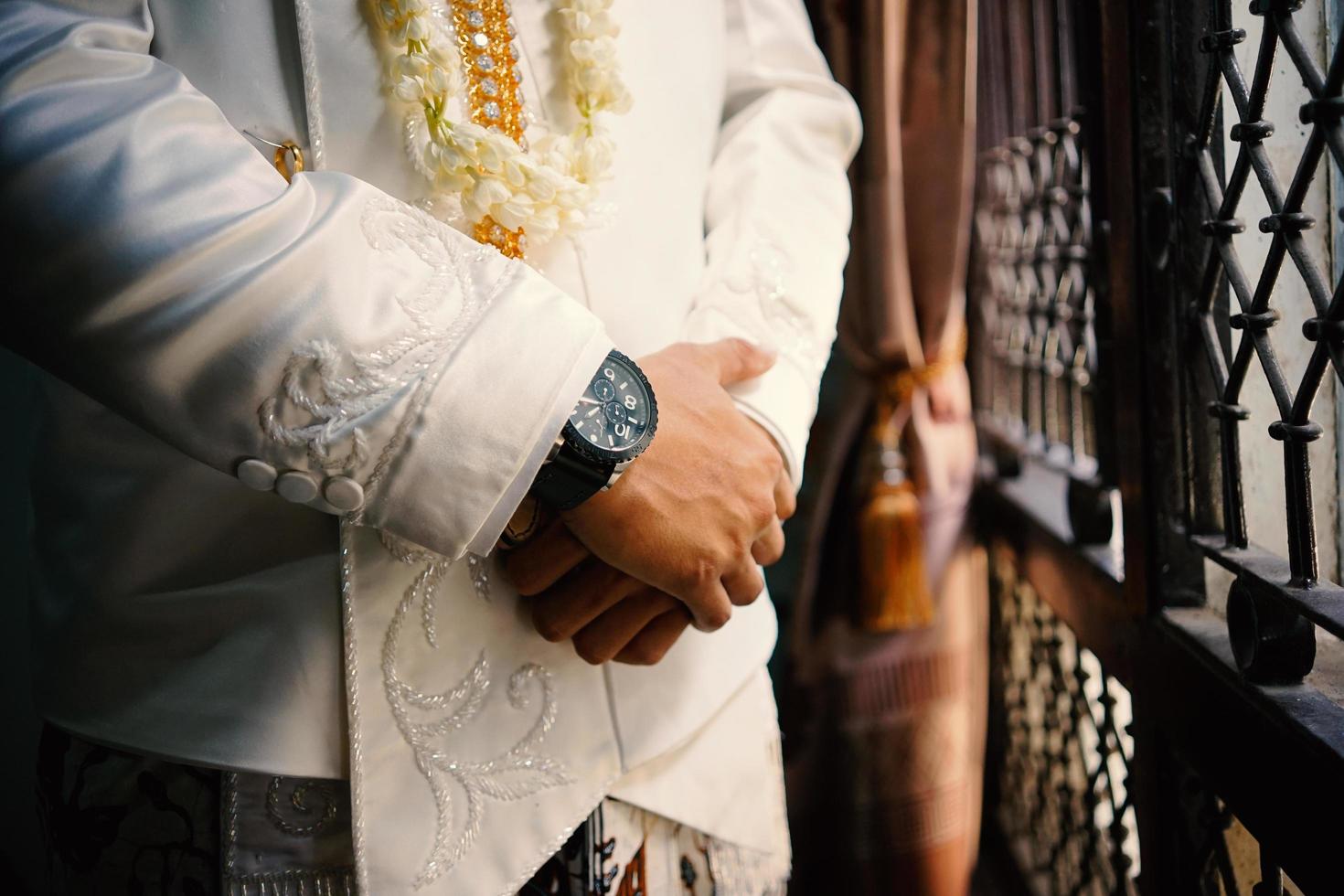 Man's watch on hand. Wedding ceremony photo