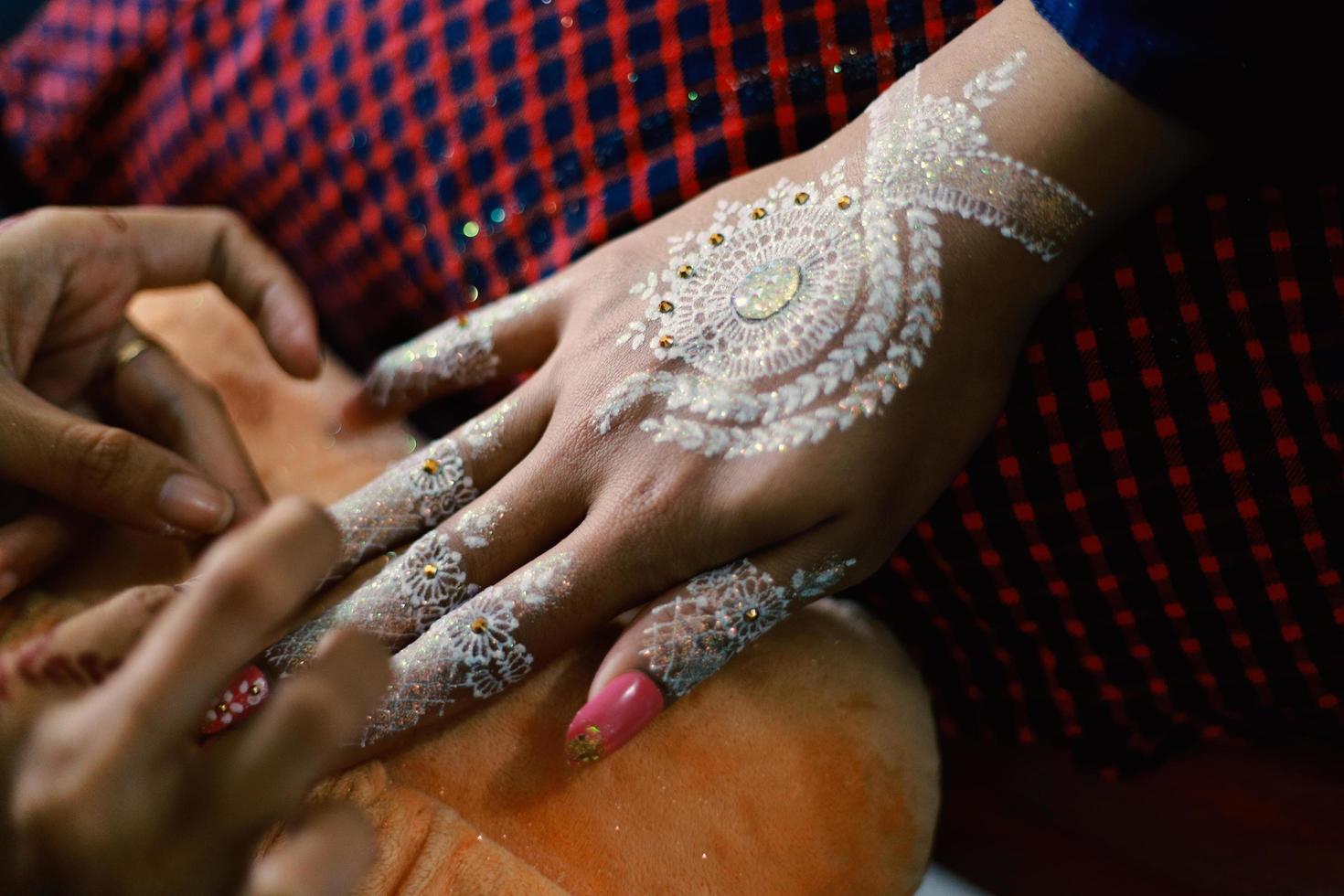 Bride henna carved beautiful and unique at bride's hand photo