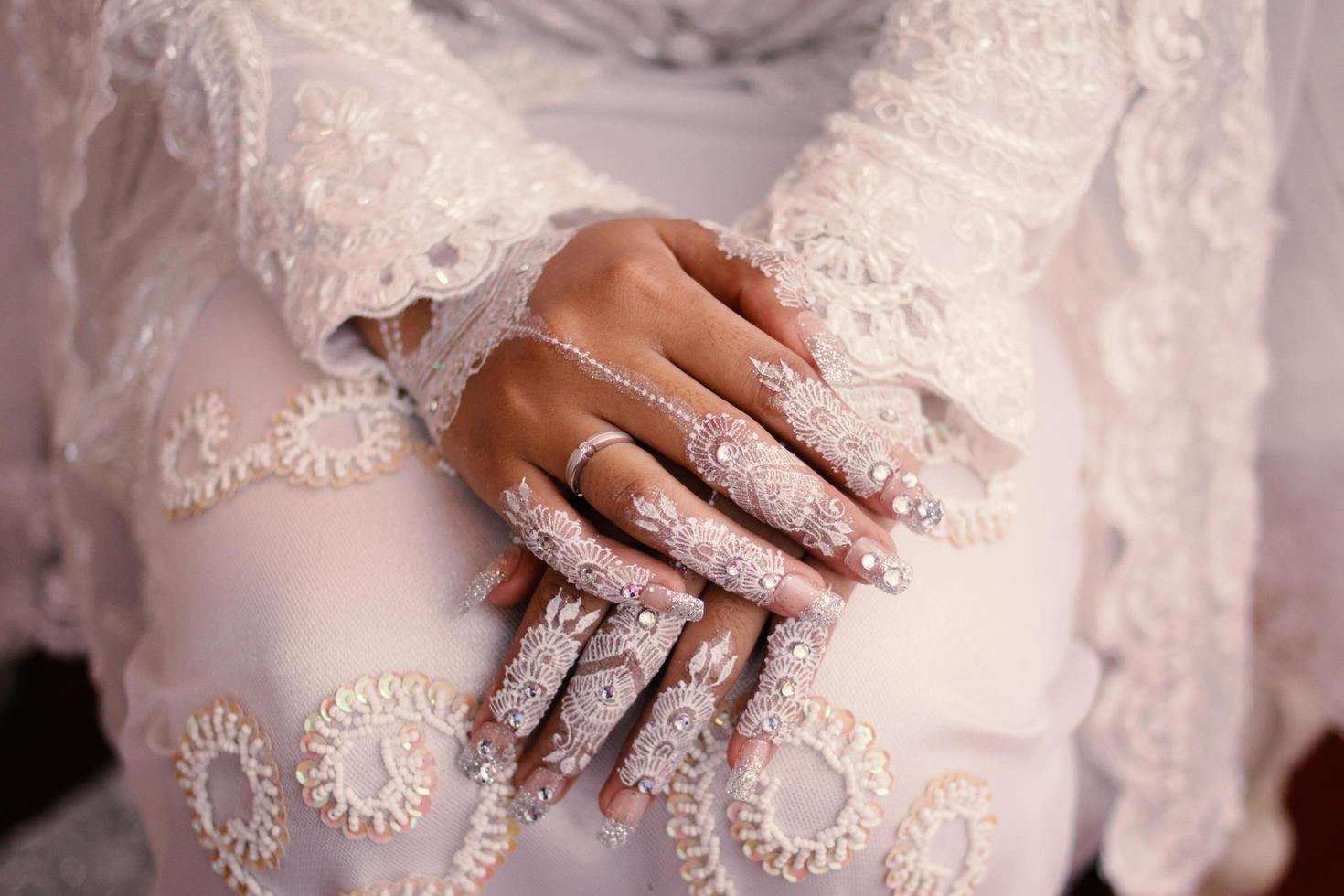 Bride henna carved beautiful and unique at bride's hand photo