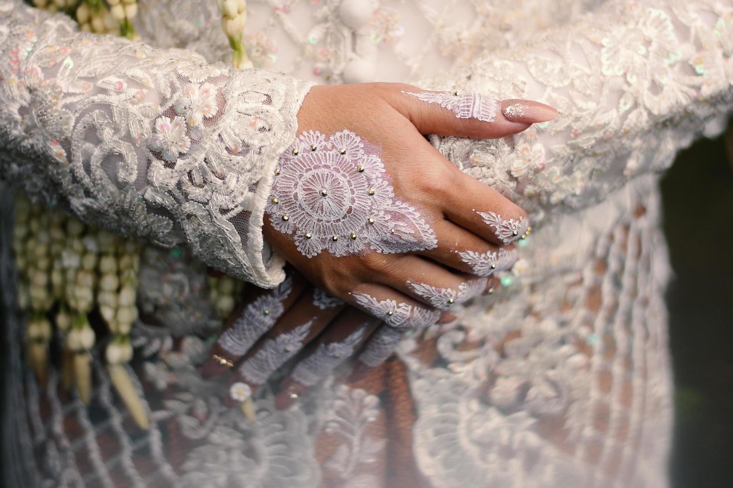 Bride henna carved beautiful and unique at bride's hand photo