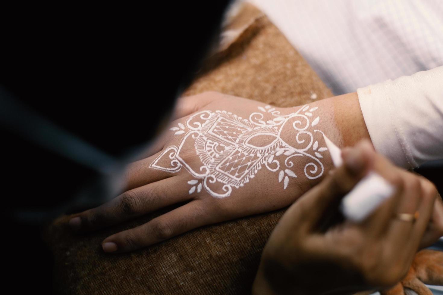 Bride henna carved beautiful and unique at bride's hand photo