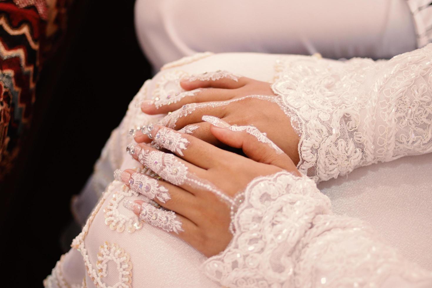 Bride henna carved beautiful and unique at bride's hand photo