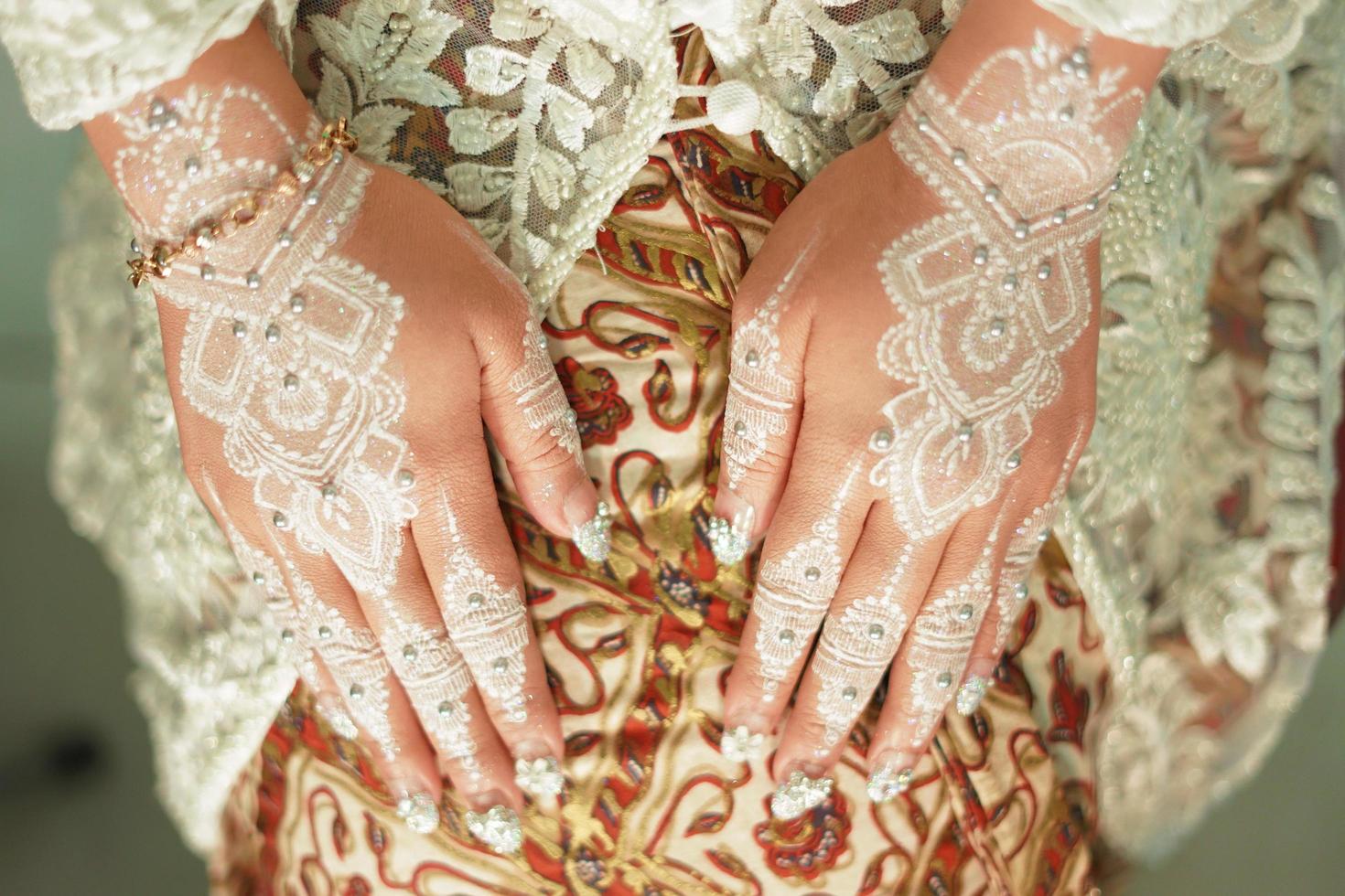 Bride henna carved beautiful and unique at bride's hand photo