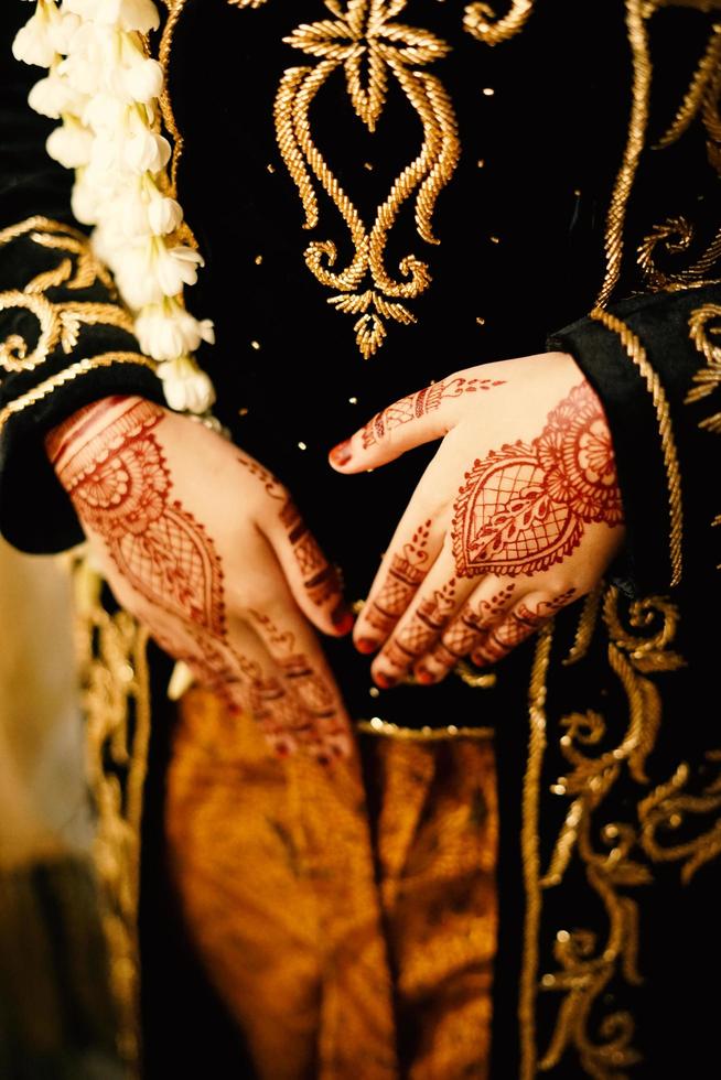 Bride henna carved beautiful and unique at bride's hand photo