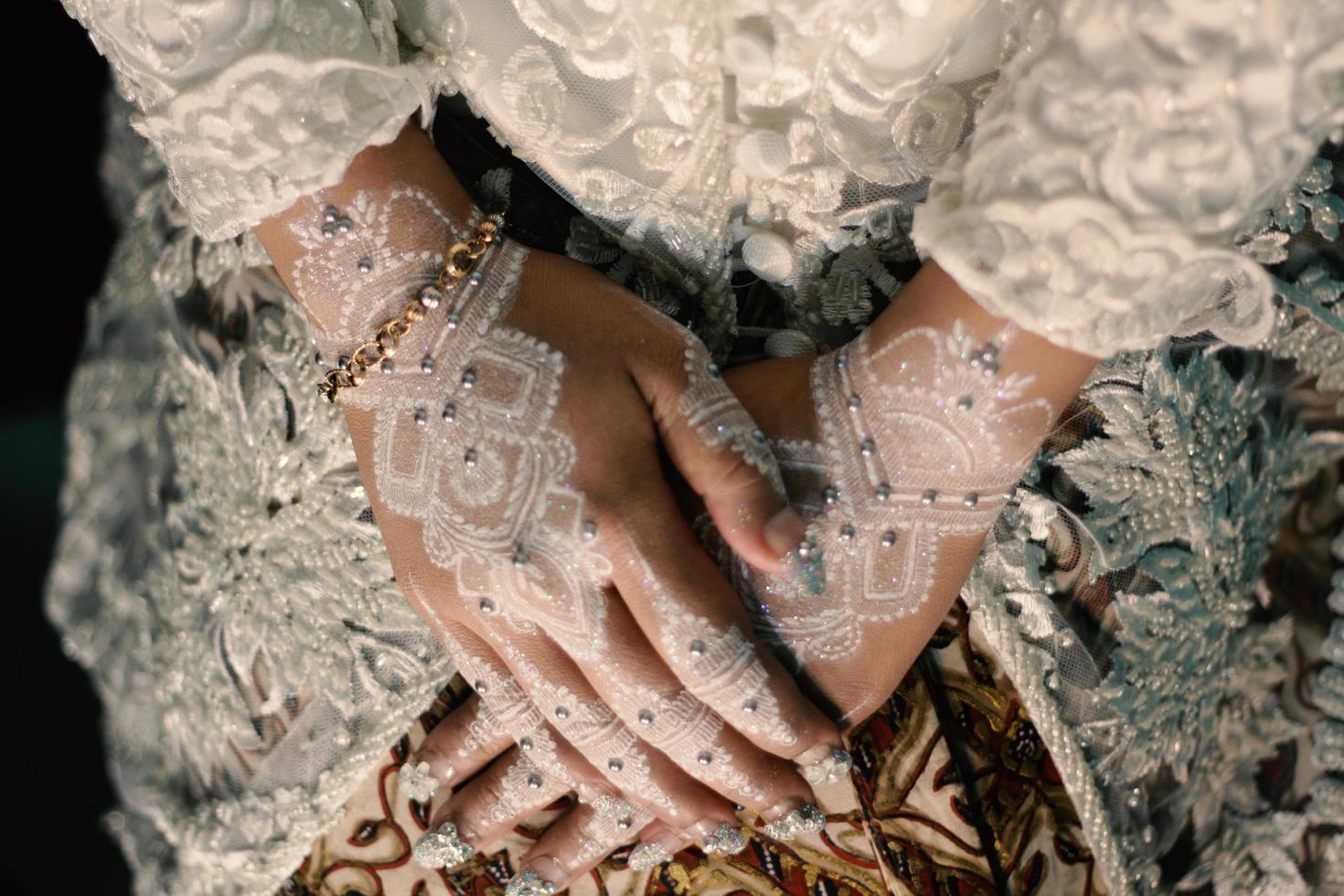 Bride henna carved beautiful and unique at bride's hand photo