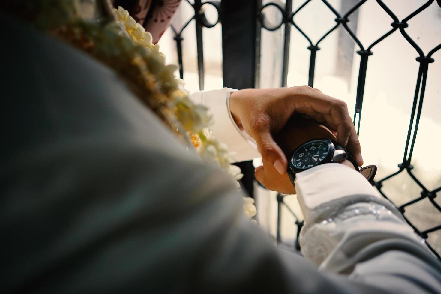 Man's watch on hand. Wedding ceremony photo