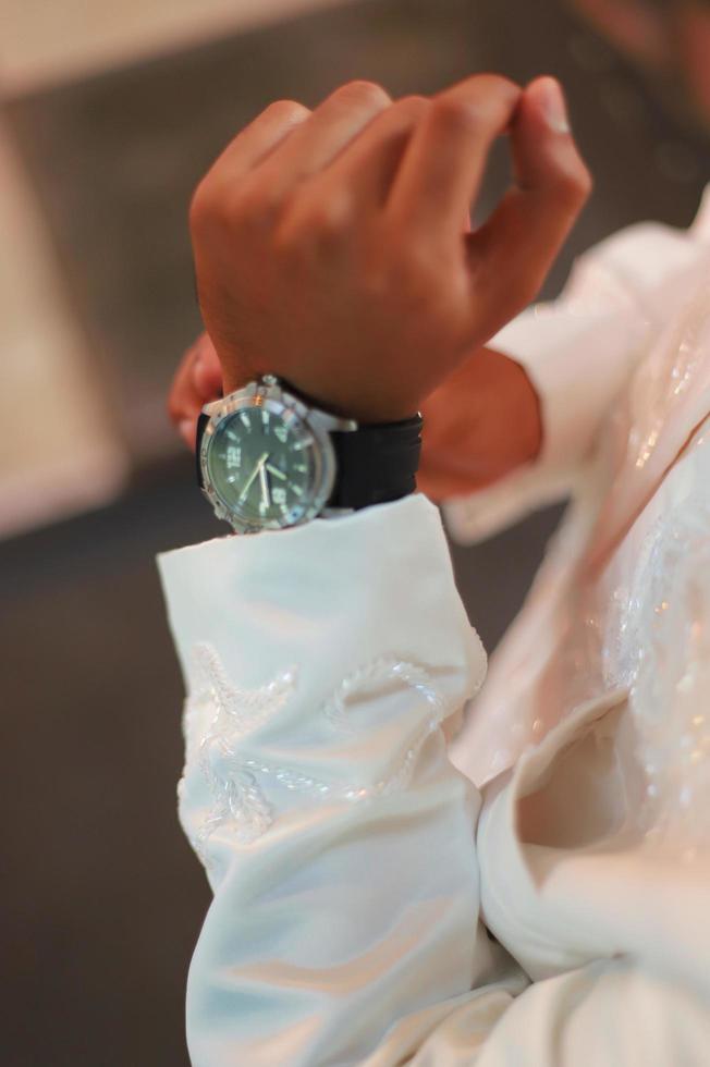 Man's watch on hand. Wedding ceremony photo