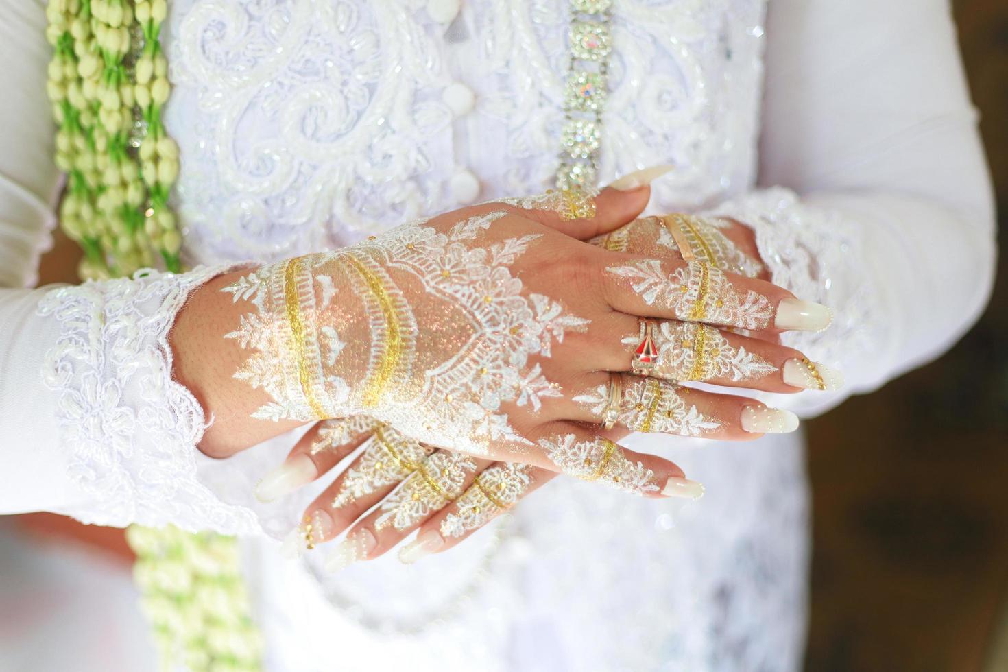 Bride henna carved beautiful and unique at bride's hand photo