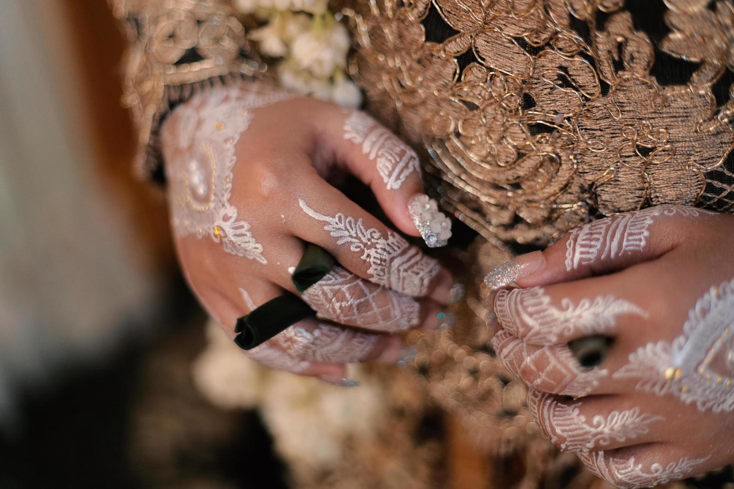 Bride henna carved beautiful and unique at bride's hand photo