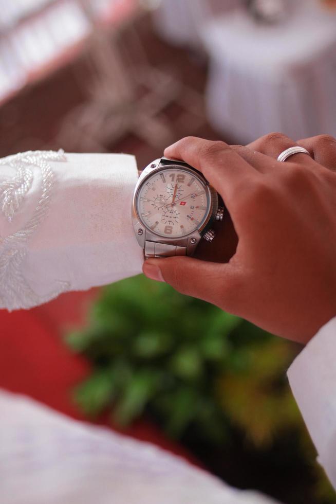 Man's watch on hand. Wedding ceremony photo