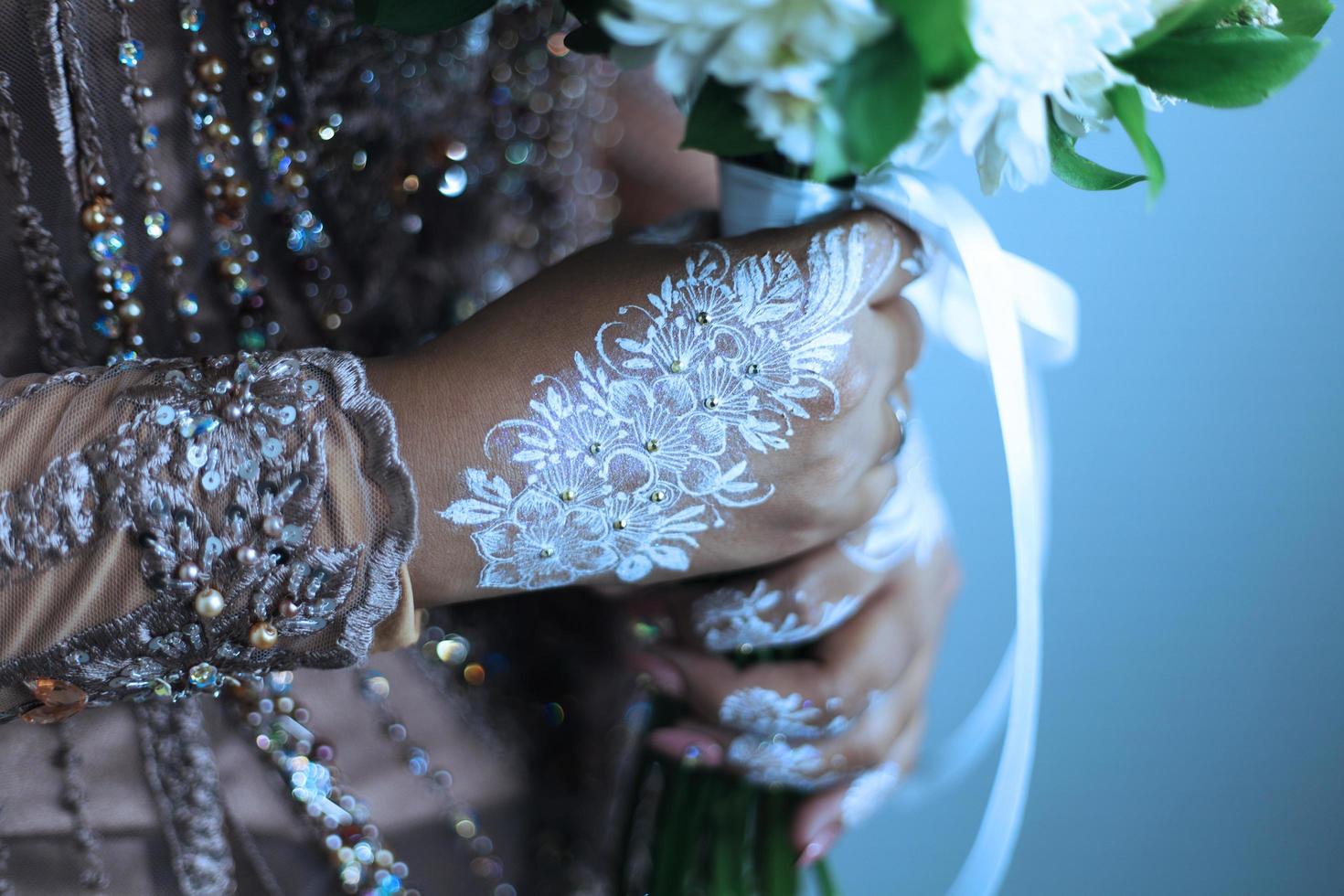 Bride henna carved beautiful and unique at bride's hand photo