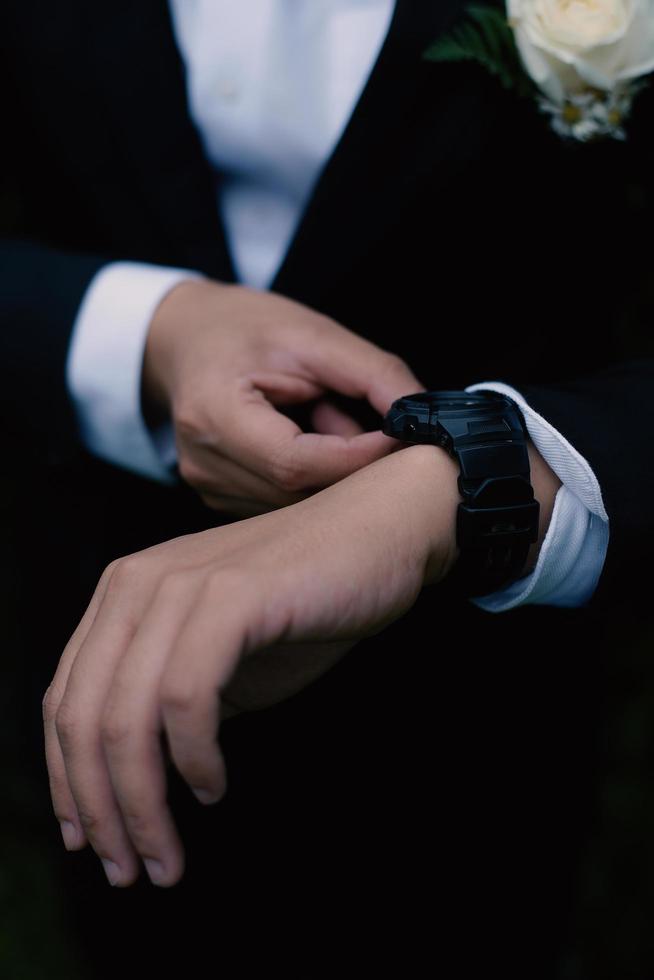 Man's watch on hand. Wedding ceremony photo