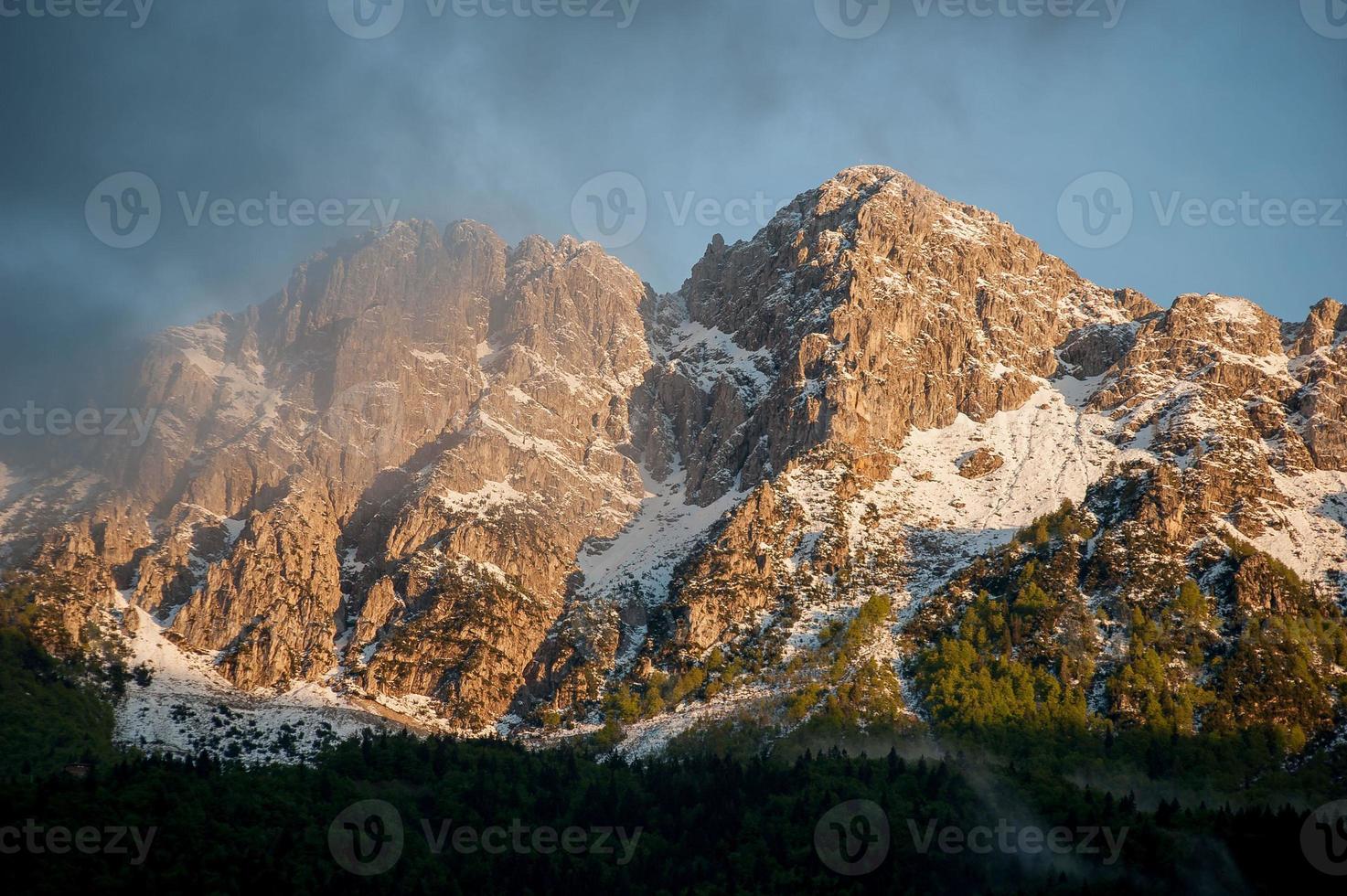 Snow-covered mountain village in spring alben photo