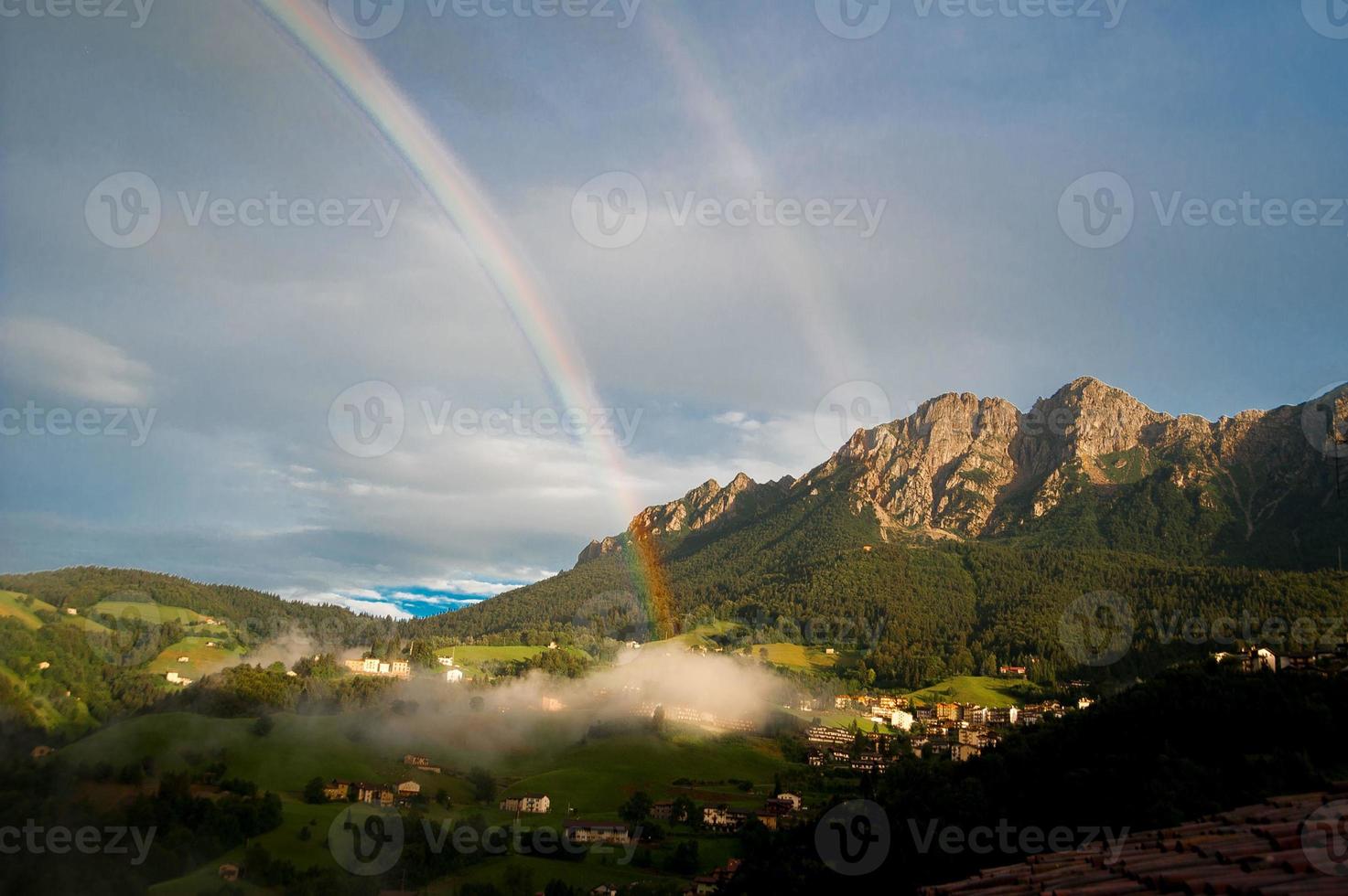 Mountain between clouds photo