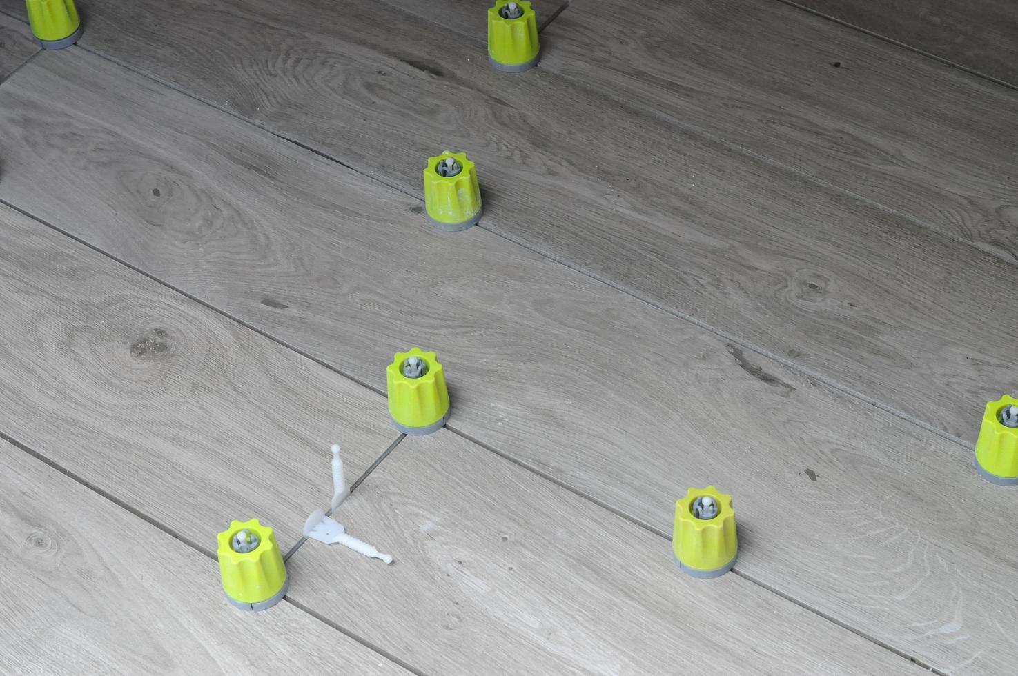 Tiling works in a building site photo