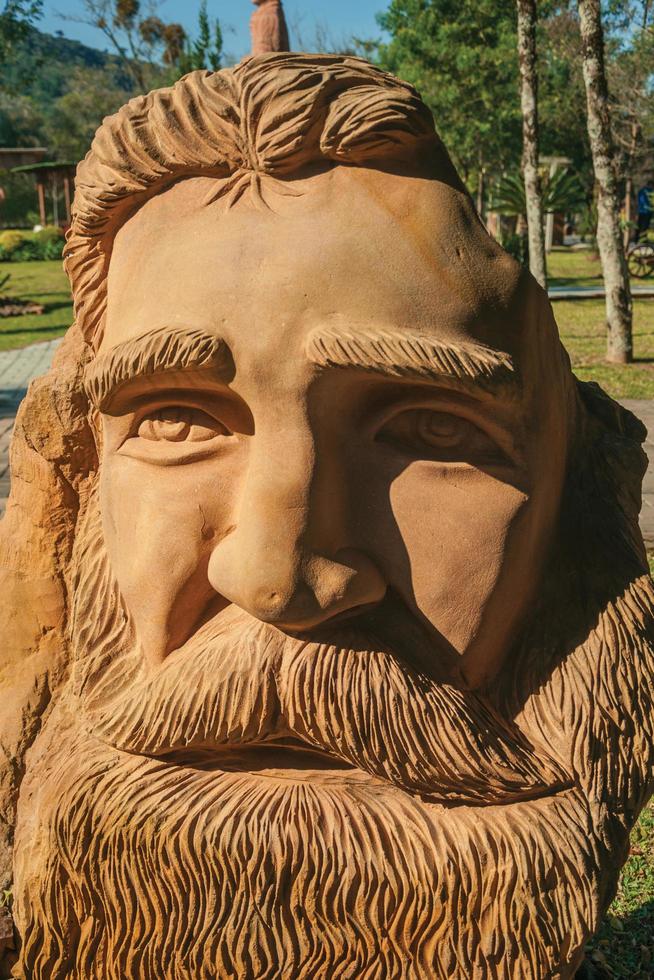 Nova Petropolis, Brazil - July 20, 2019. Sandstone sculpture of a man with bearded face at the Sculpture Park Stones of Silence near Nova Petropolis. A lovely rural town founded by German immigrants. photo
