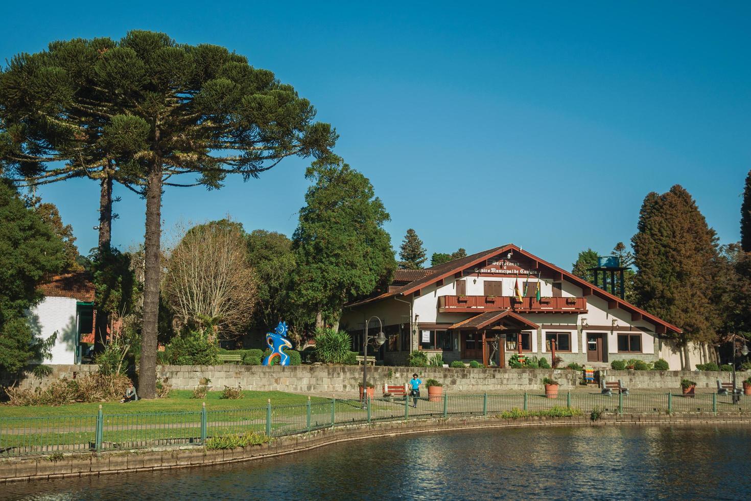 Gramado, Brazil - July 21, 2019. Charming house from Municipal Cultural Center in German-influence style on a park of Gramado. A cute european-influenced town highly sought after by tourists. photo