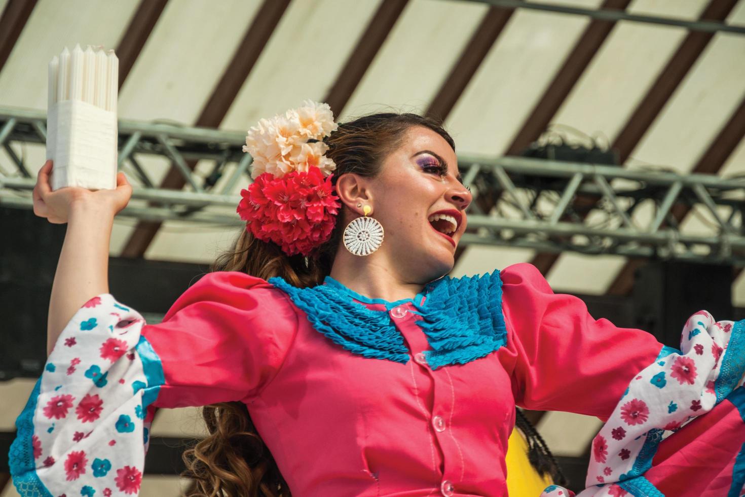 Nova Petropolis, Brazil - July 20, 2019. Colombian female folk dancer performing a typical dance on 47th International Folklore Festival of Nova Petropolis. A rural town founded by German immigrants. photo