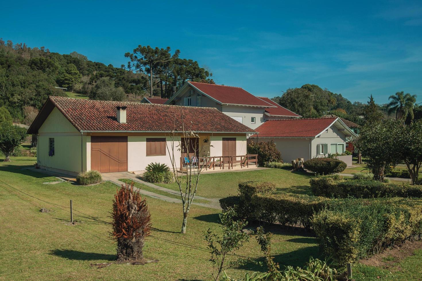 Bento Goncalves, Brazil - July 11, 2019. Modern country house with pathway and garden in a rural landscape near Bento Goncalves. photo