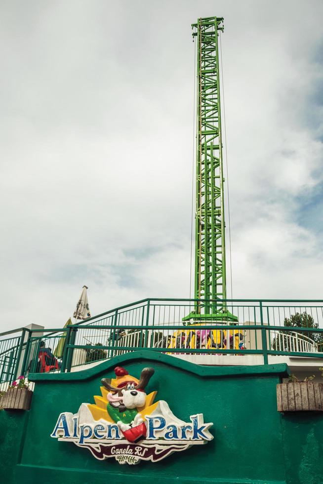 Canela, Brazil - July 21, 2019. The Alpen Turbo Drop ride and logo of Alpen amusement park near Canela. A charming small town very popular by its ecotourism. photo