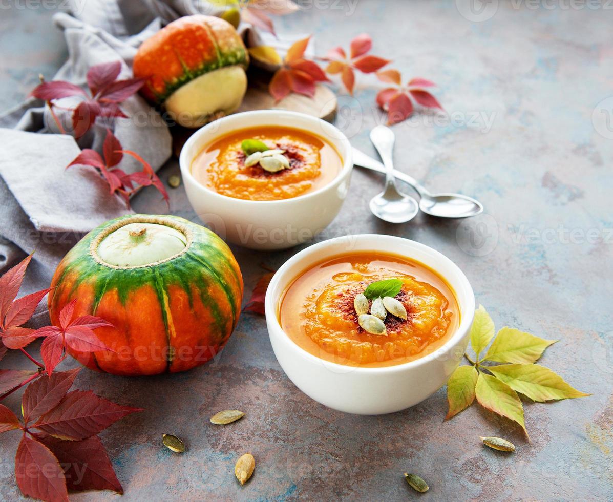 Bowls of pumpkin soup photo