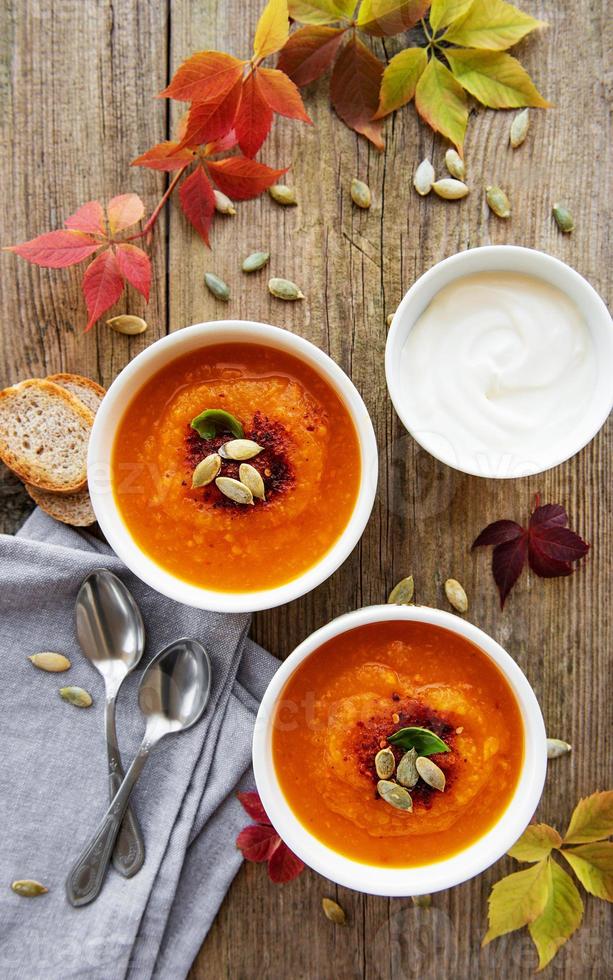 Bowls of pumpkin soup photo