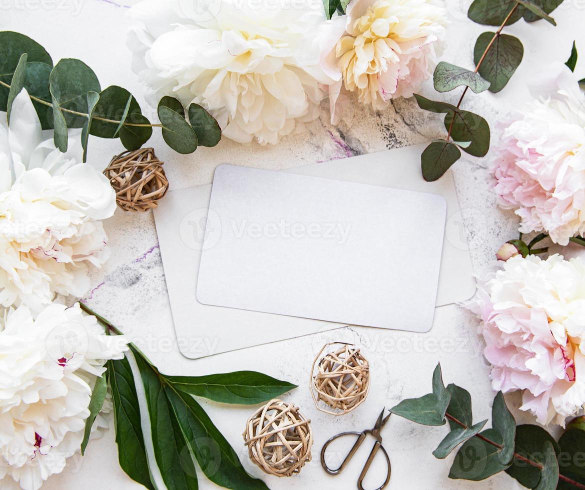 Wedding invitation with pink peonies photo