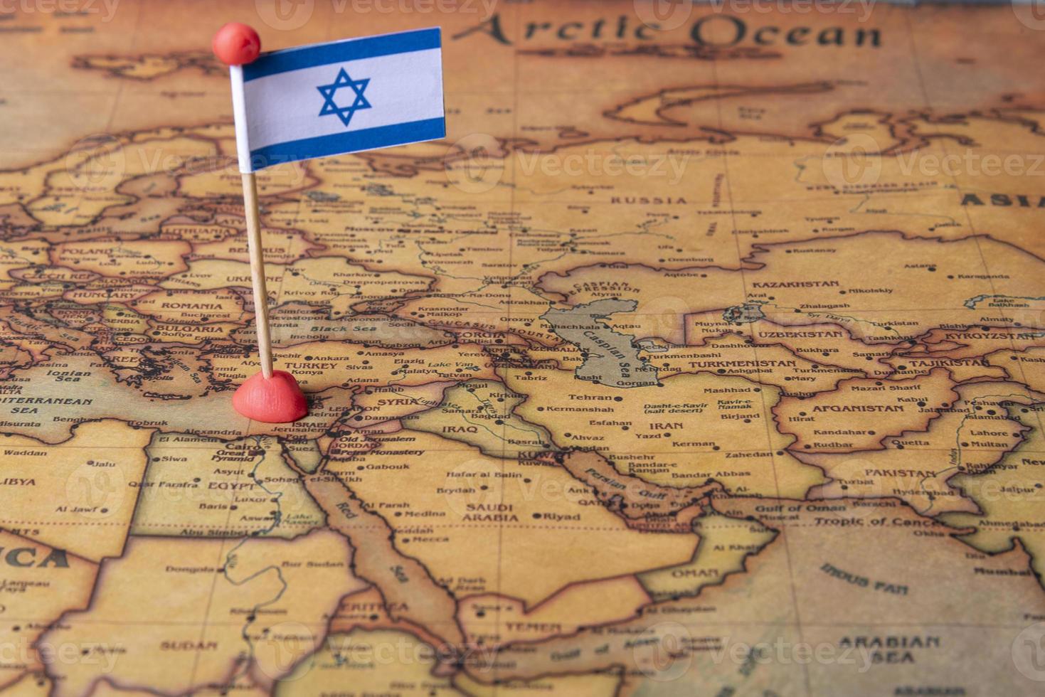 Israeli flag and plane on the world map. photo