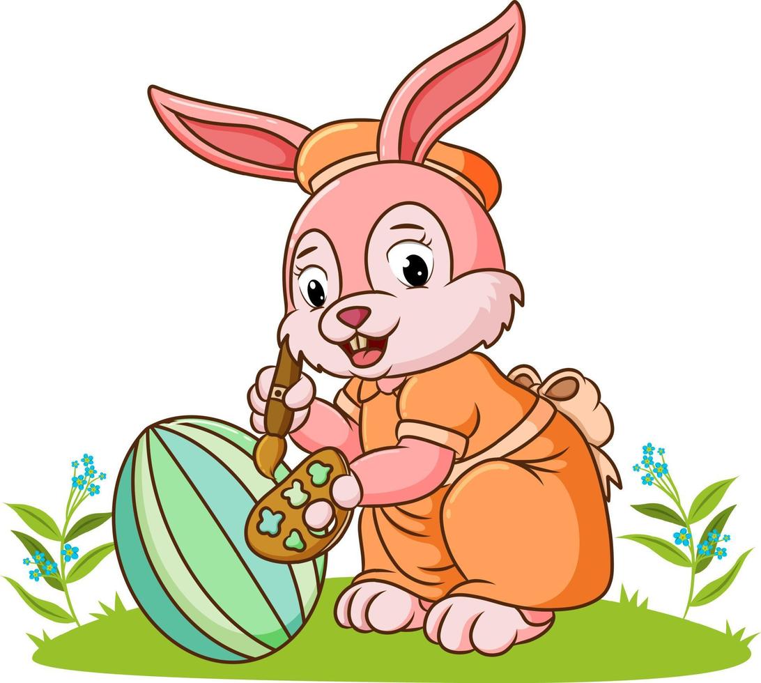 The cute rabbit is coloring the ester egg vector