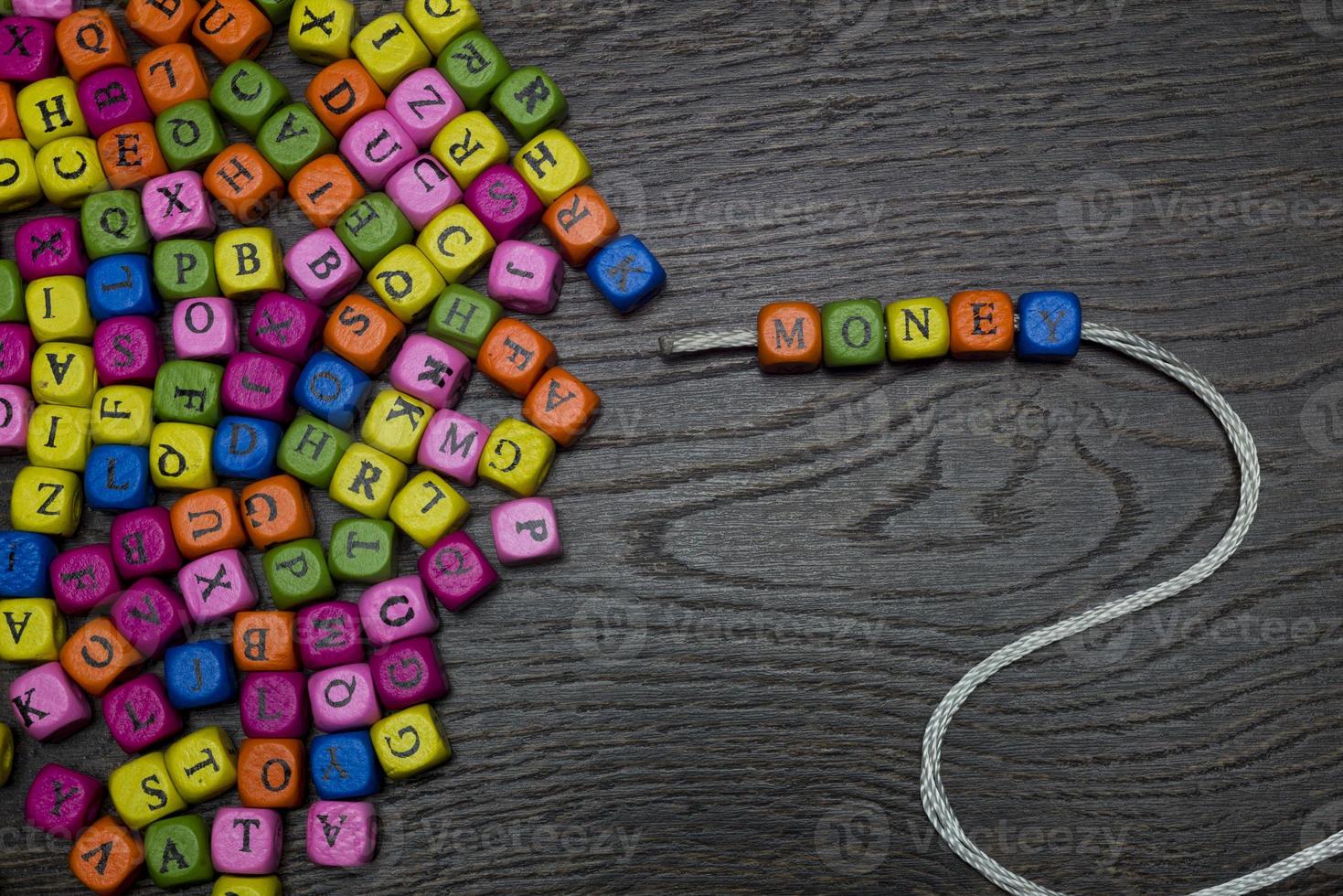 The word money from the beads. photo