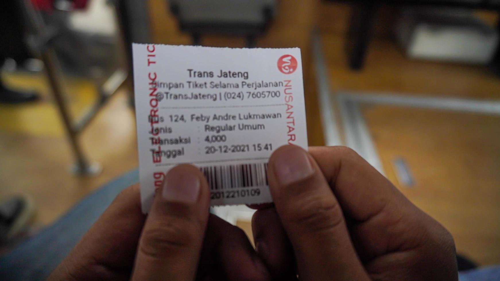 Semarang, Central Java, Indonesia, 2021 - ticket proof of taking the public transportation, bus rapid transit system photo