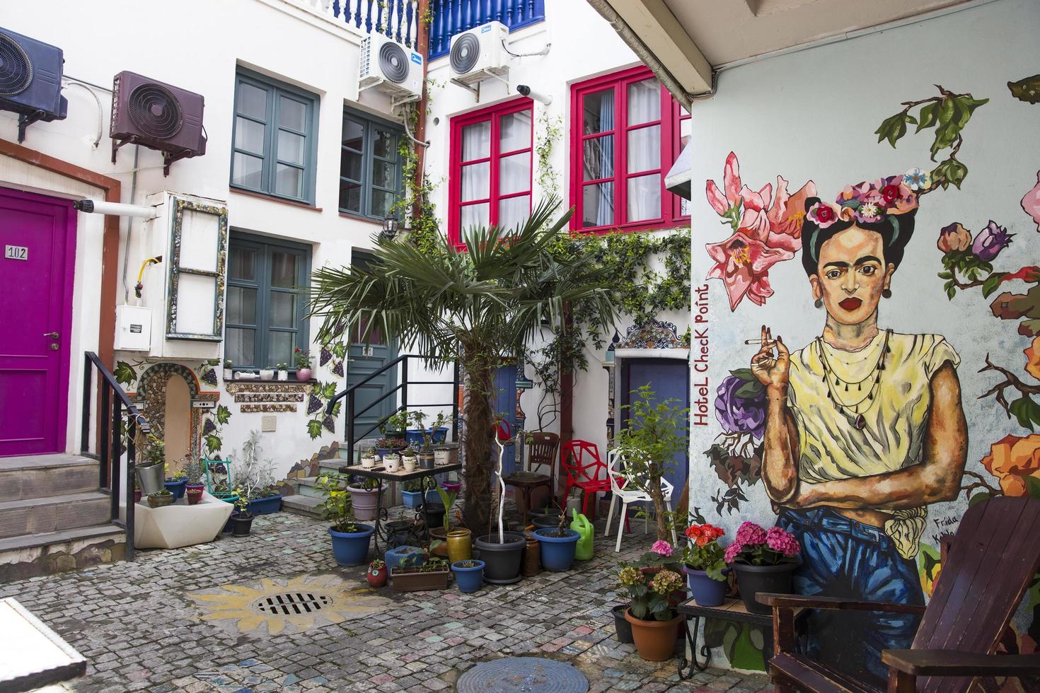 Tbilisi, Georgia, 2019 - Frida Kahlo portrait on the wall of Check Point Hotel in Tbilisi, Georgia. Portrait of famous Mexican artist was made by Tako Tsulaia at 2016. photo