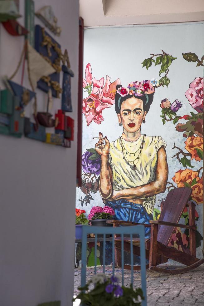 Tbilisi, Georgia, 2019 - Frida Kahlo portrait on the wall of Check Point Hotel in Tbilisi, Georgia. Portrait of famous Mexican artist was made by Tako Tsulaia at 2016. photo