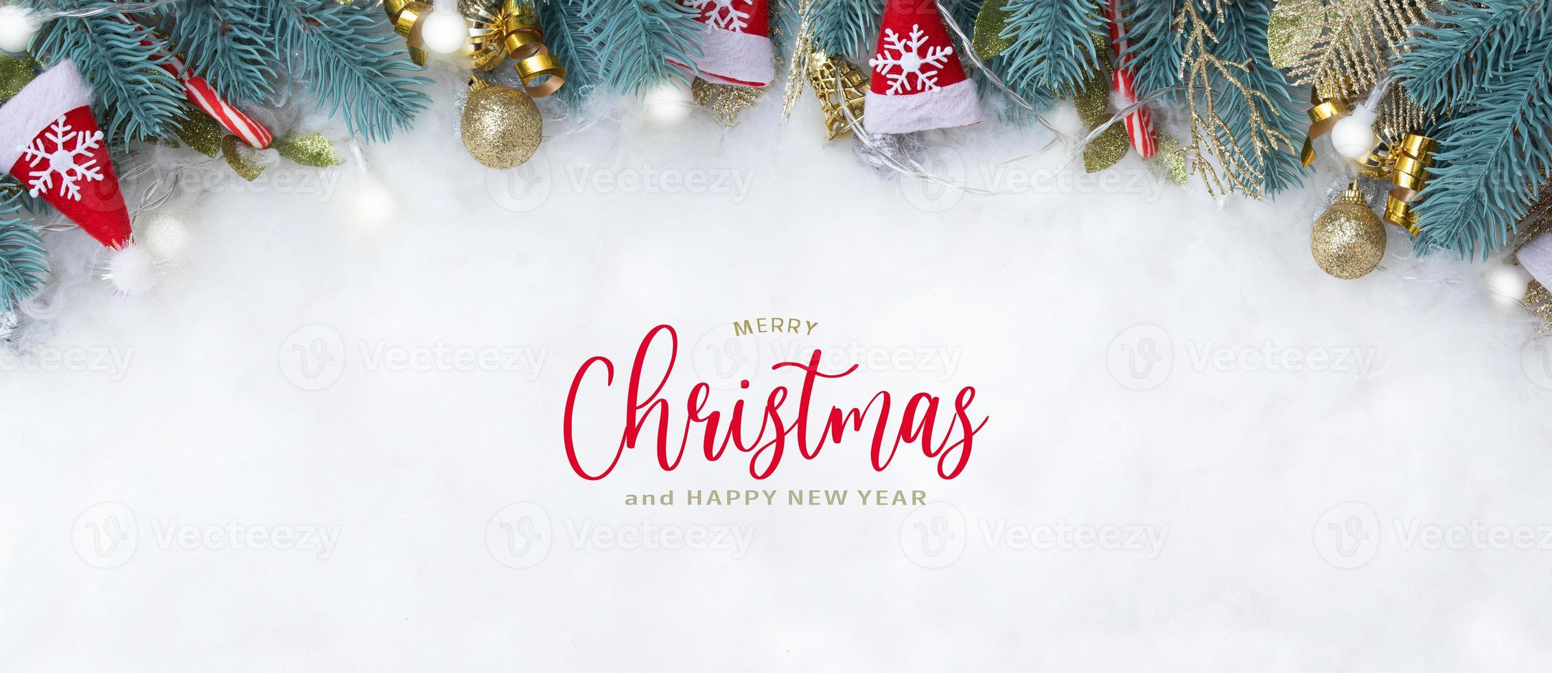 Banner with Merry Christmas text and fir branches Christmas decorations flat lay on snowy background photo