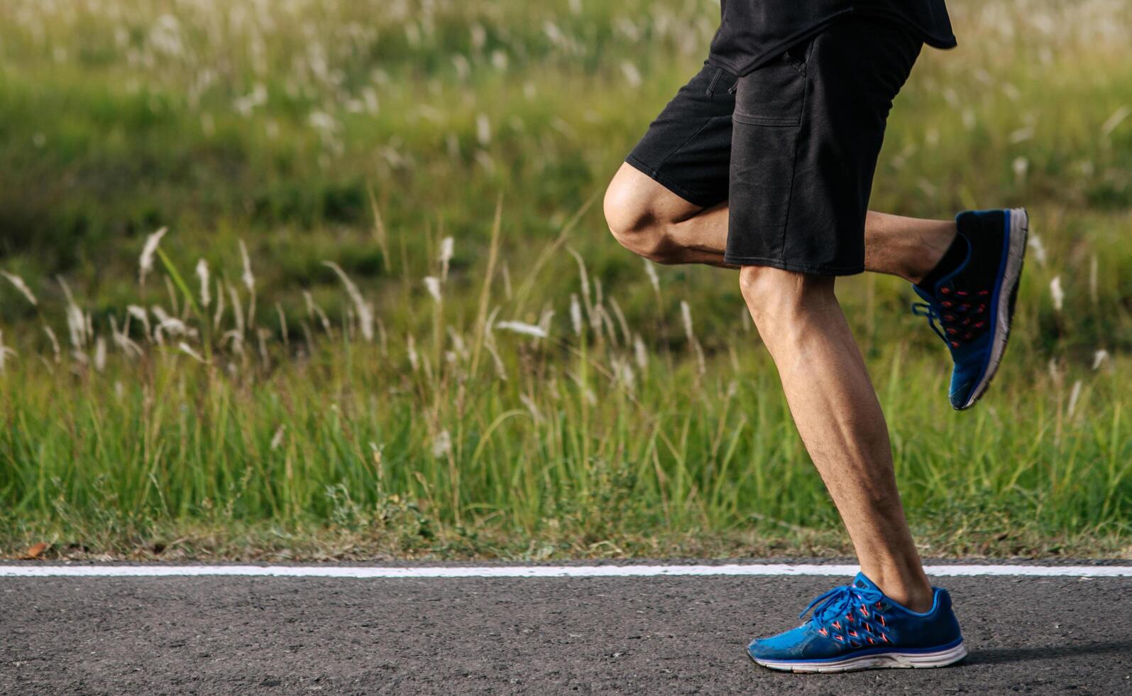 Men and women exercise by running on the road. photo