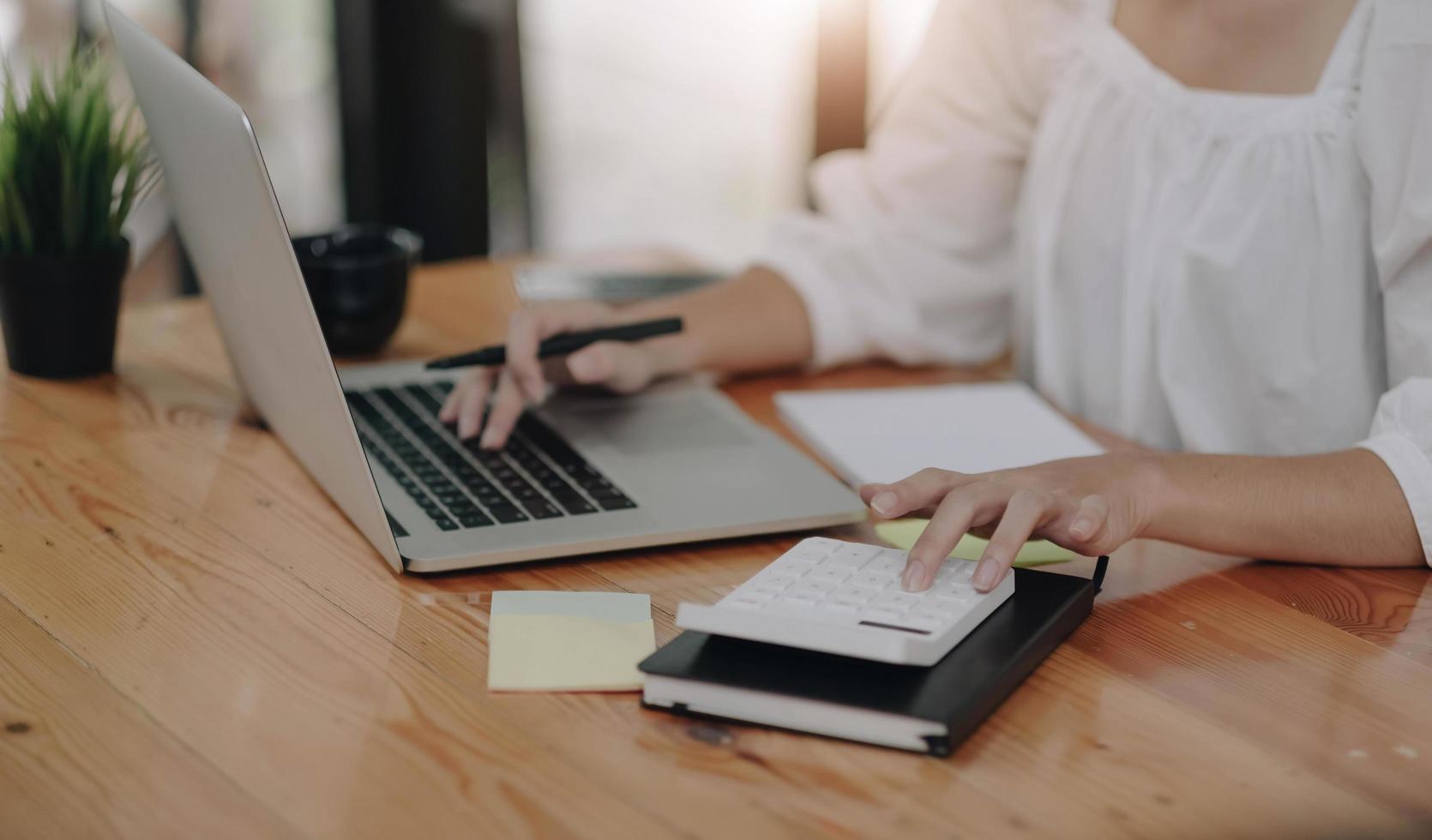 woman financial inspector and secretary making report calculating balance. Internal Revenue Service checking document. Audit concept photo