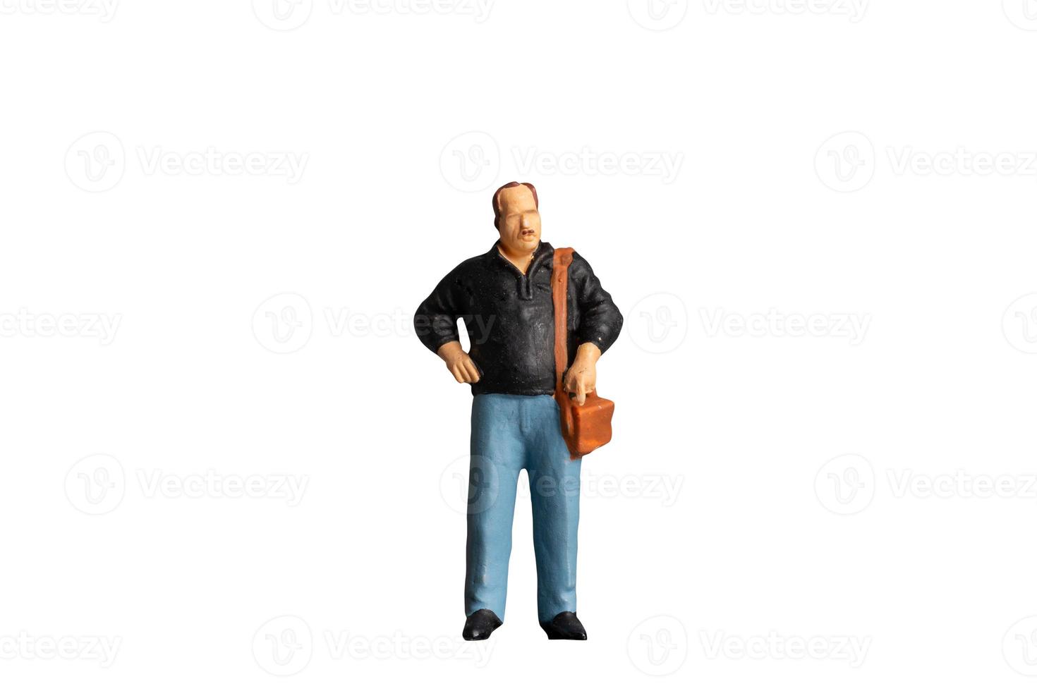 Miniature people Old man holding a shoulder bag  standing on white background with clipping path photo