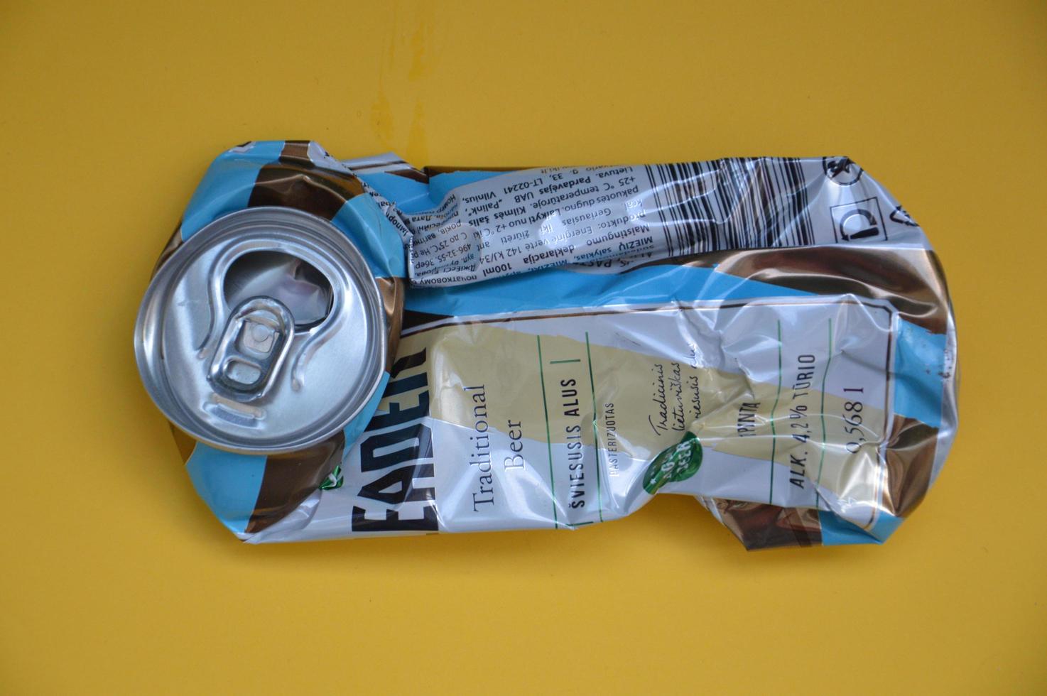 KIEV, UKRAINE - DECEMBER 22, 2021 Crumpled beer cans for scrap photo