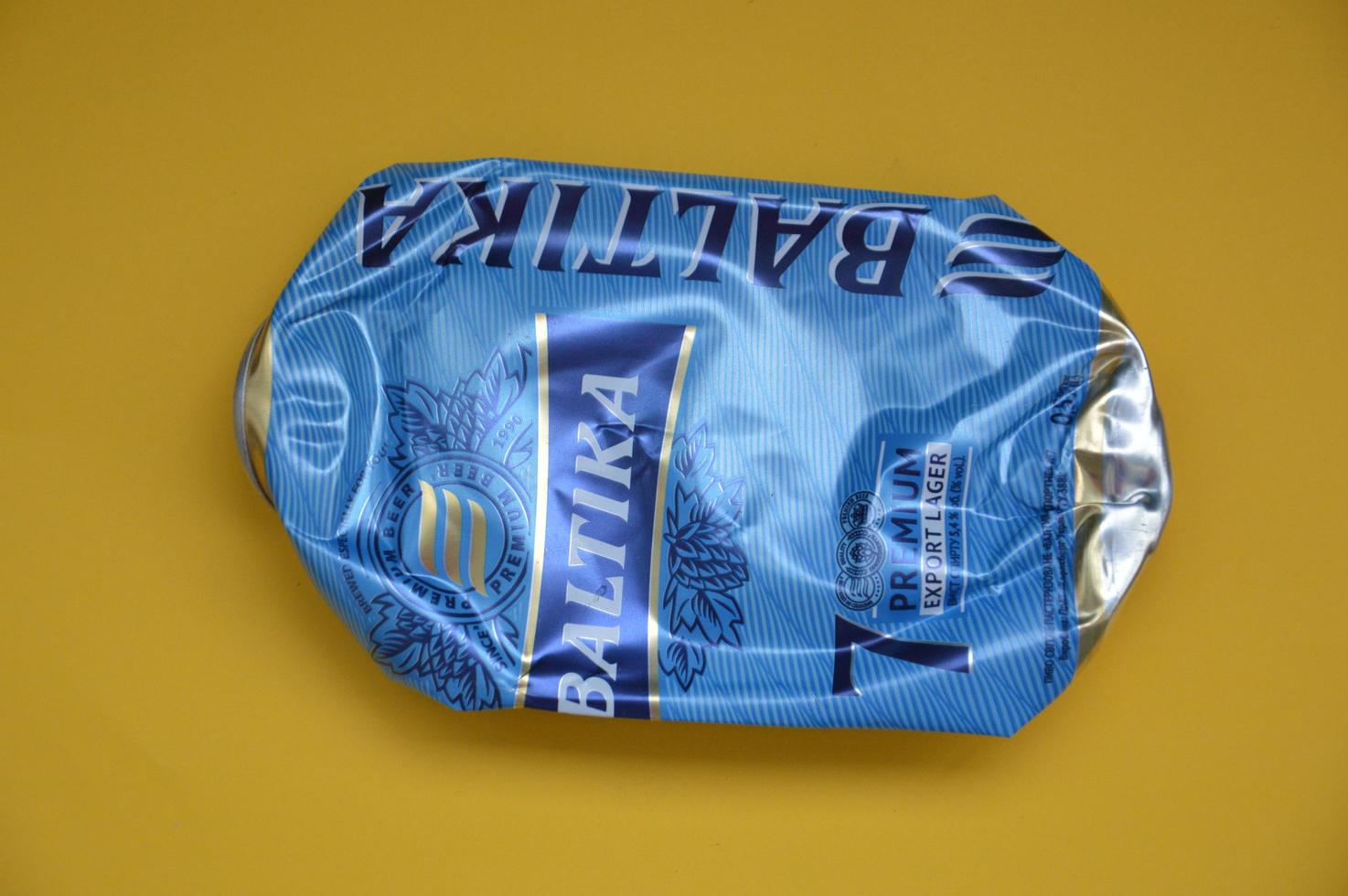 KIEV, UKRAINE - DECEMBER 22, 2021 Crumpled beer cans for scrap photo